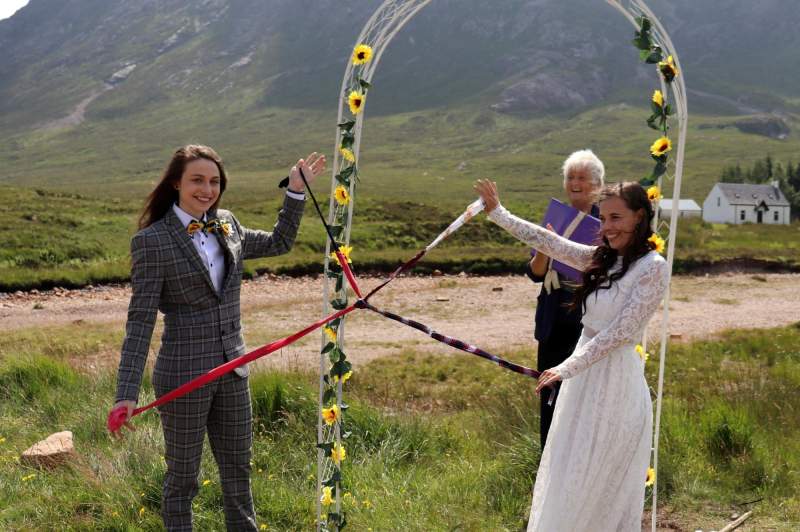 Jumping the broom and handfasting at traditional Celtic wedding at Glen Coe