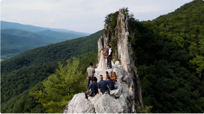 A couple spent 5 hours climbing a mountain in their wedding attire to get married at the top