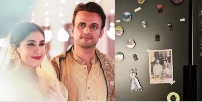Usman Mukhtar's wife sticks their wedding card on her fridge door